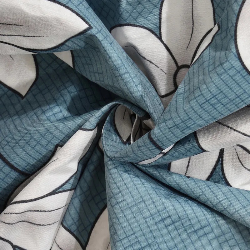 Close-up of the blue textured polycotton-blend fabric and white floral print