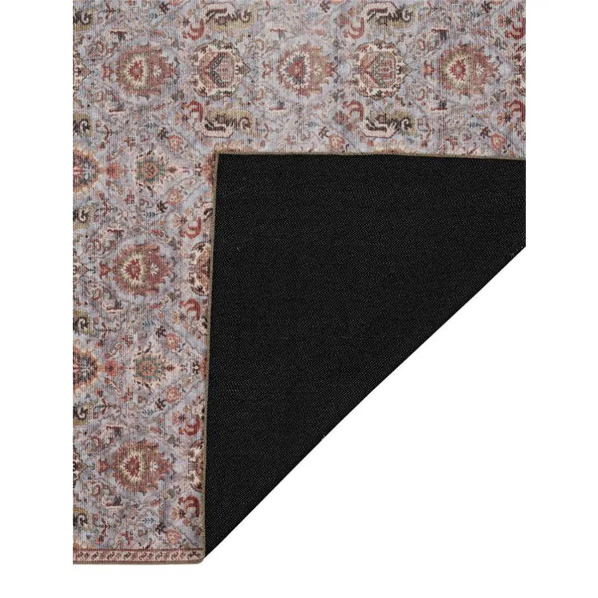 Carpet corner showing patterned top and black underside