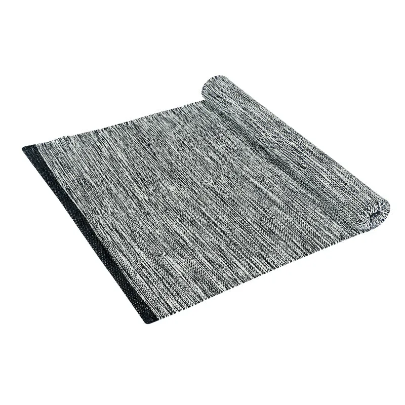 Partially rolled charcoal-grey runner rug with dark borders on a white background.
