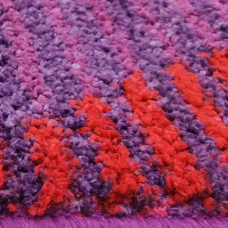 Close-up view of the rug's purple and red pile