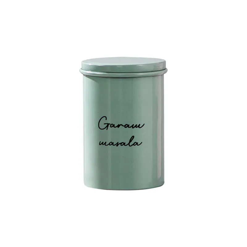 Single pastel green cylindrical storage jar isolated on a white background