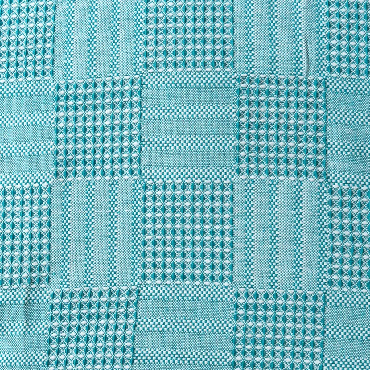 Detailed view of the bedsheet's small woven-looking geometric surface pattern