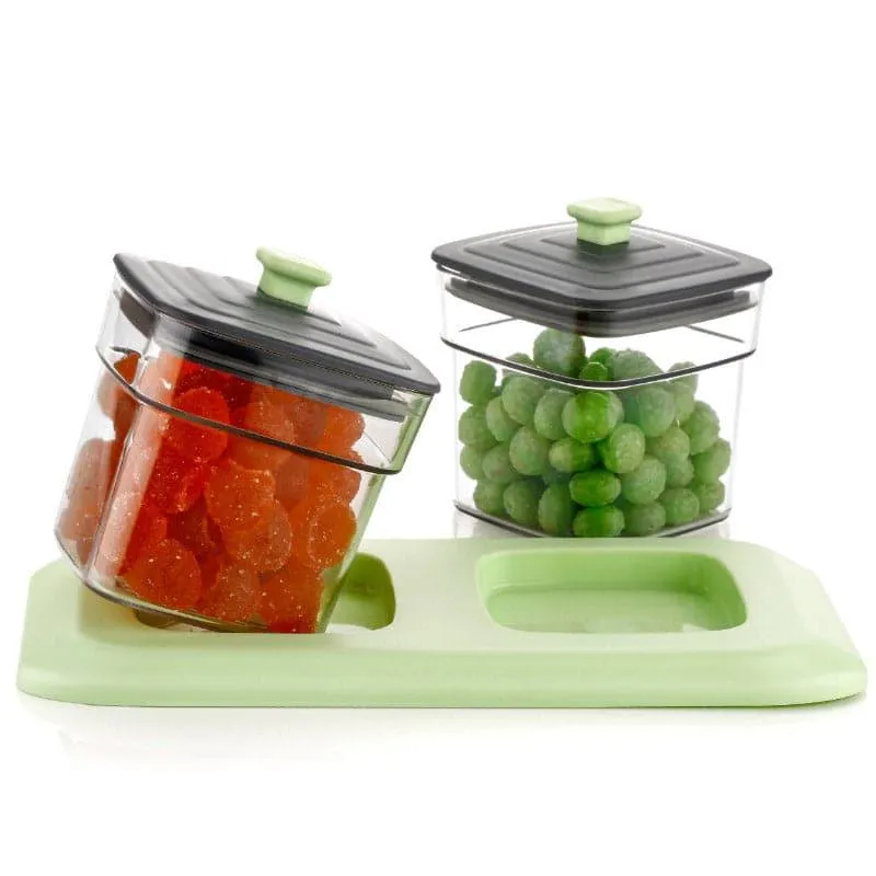 Two transparent storage containers with black lids and mint knobs on a mint tray.