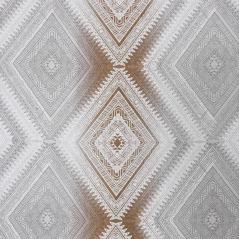 Detailed view of the bedsheet's geometric diamond pattern in brown, grey and white