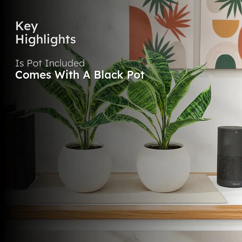 Two faux plants displayed in white pots beside a home accessory