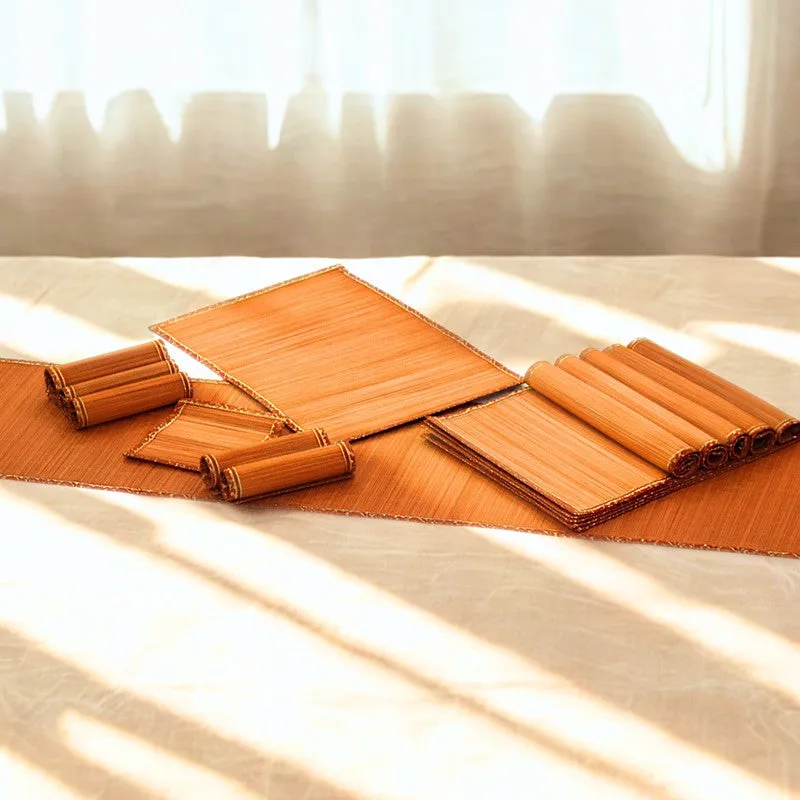 Orange table mats and rolled mats arranged in warm sunlight