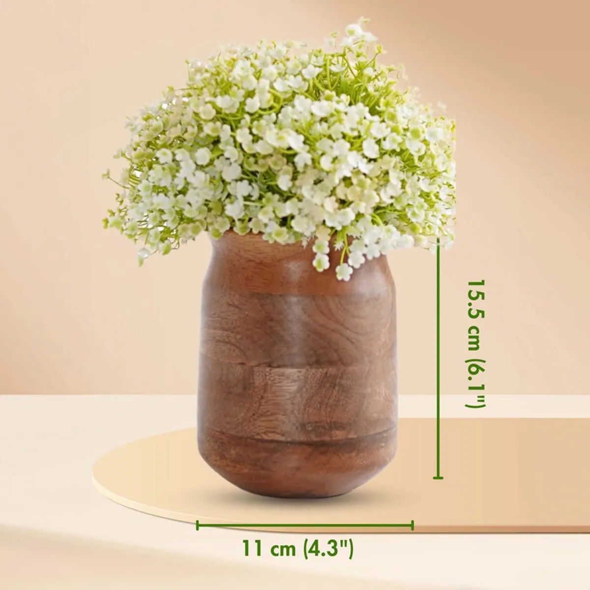Dark brown wooden vase with white flowers against a soft peach backdrop