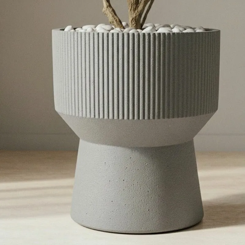 Close view of the grey planter's vertical ribs and speckled finish