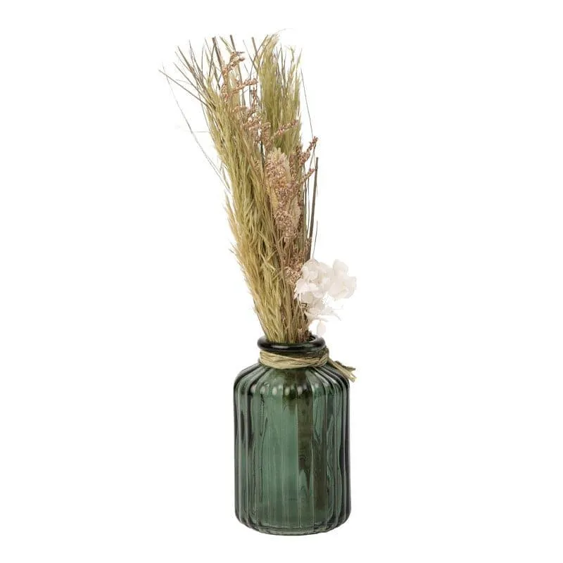 Angled view of green ribbed glass vase with dried flowers