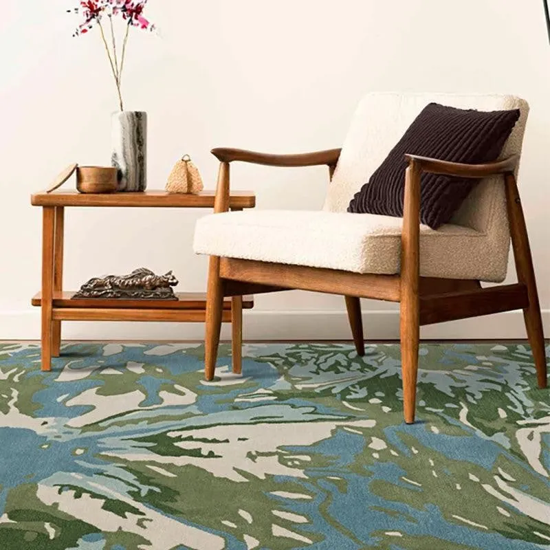 Blue and green floral carpet placed under a chair and side table