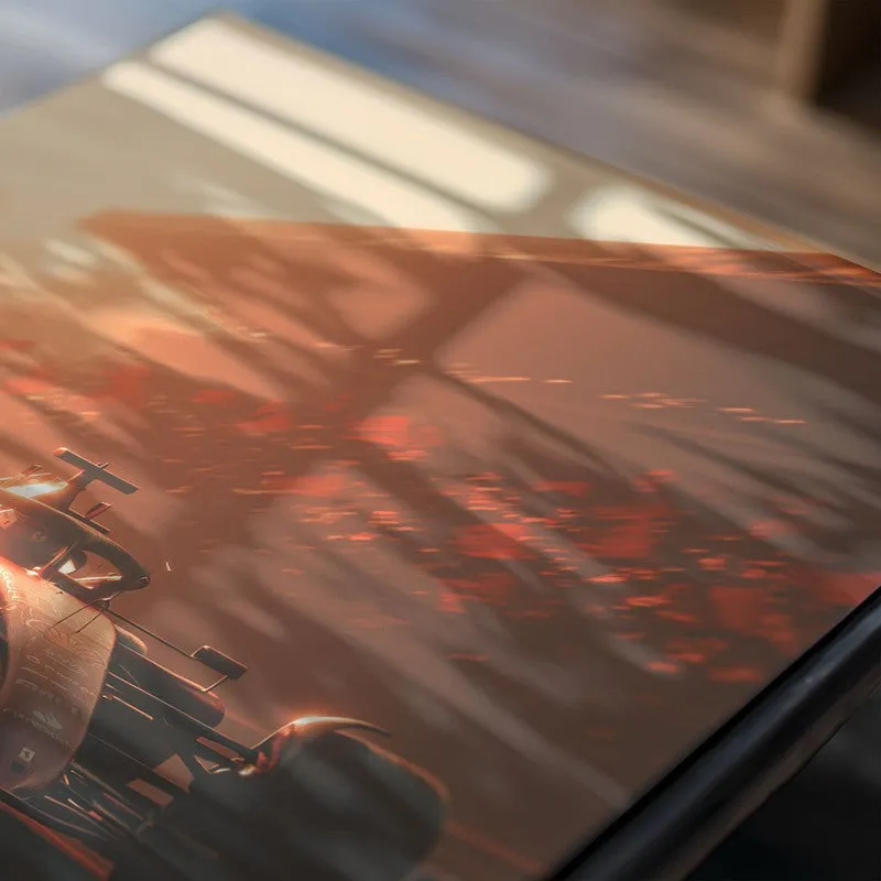 Close-up of a glossy racing car poster in warm orange tones