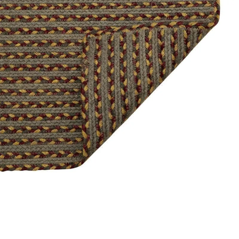 Folded corner of woven brown jute bath mat showing underside texture