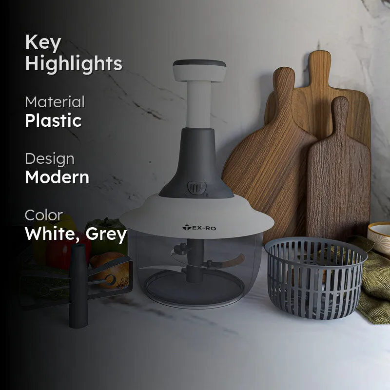 White and grey manual chopper styled on a kitchen counter with vegetables and cutting boards