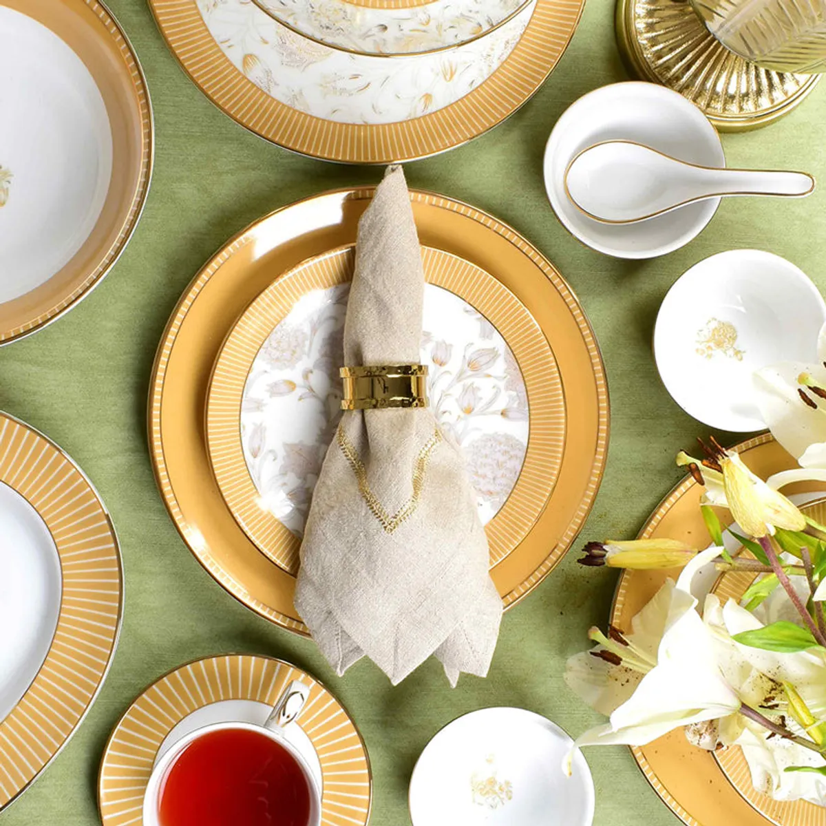 Top view of a mustard and floral dinner setting with plates and bowls