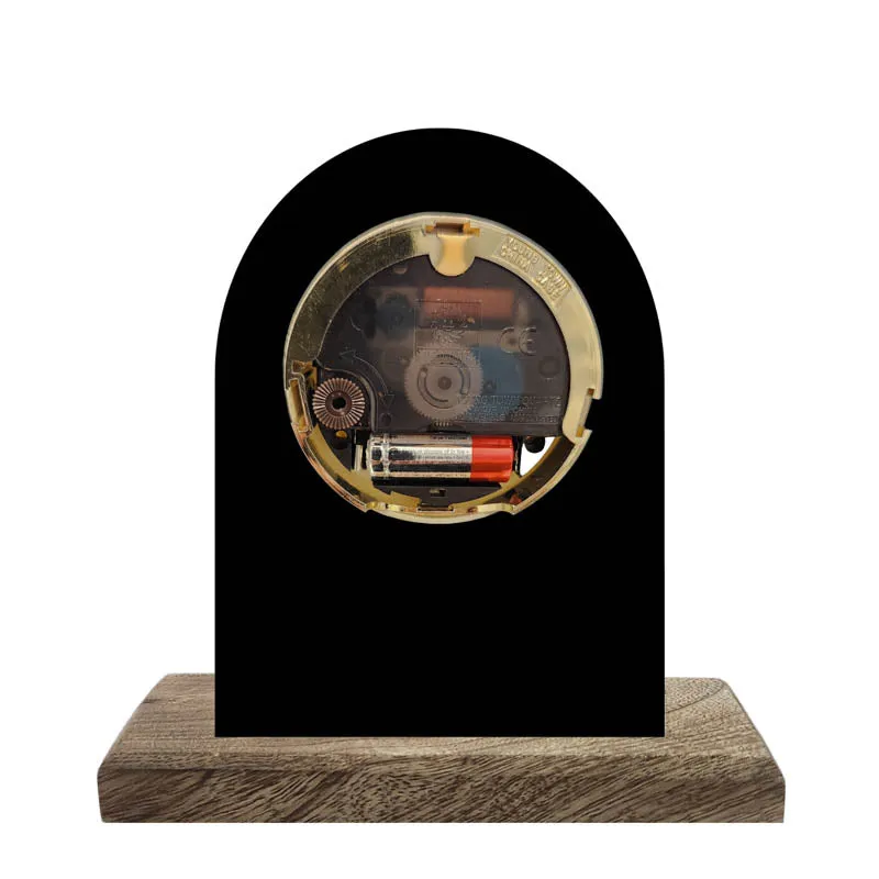 Back view of table clock with battery compartment on wood base