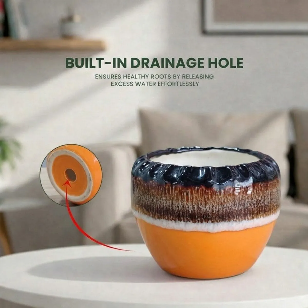 Glossy ceramic planter shown with a visible opening and orange, brown and black finish.