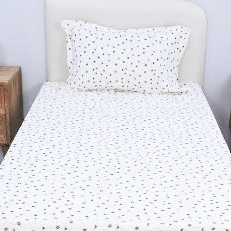 Front view of white floral bedsheet with matching pillow cover on a single bed