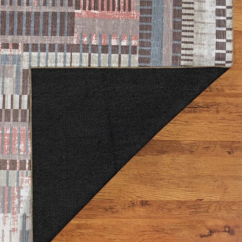 Back corner of the carpet showing the dark underside