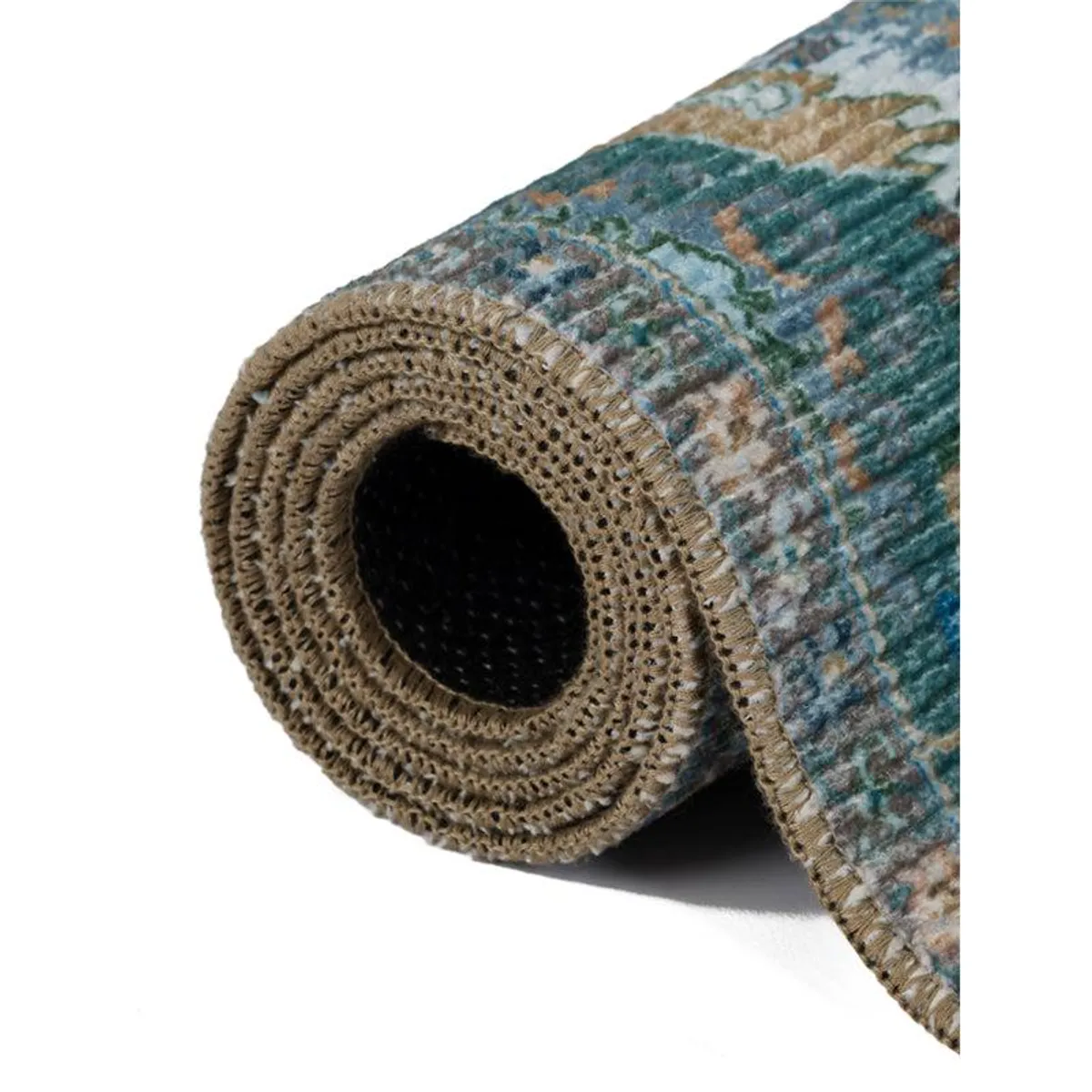 Rolled carpet close-up showing patterned surface, finished edge and dark underside