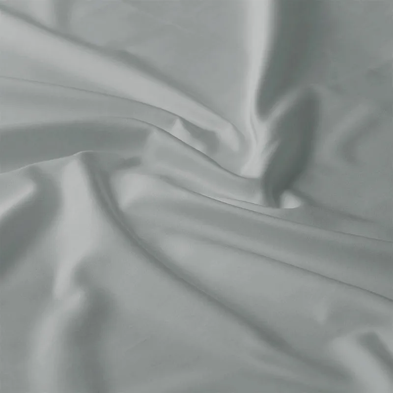 Close-up of smooth light grey cotton fabric