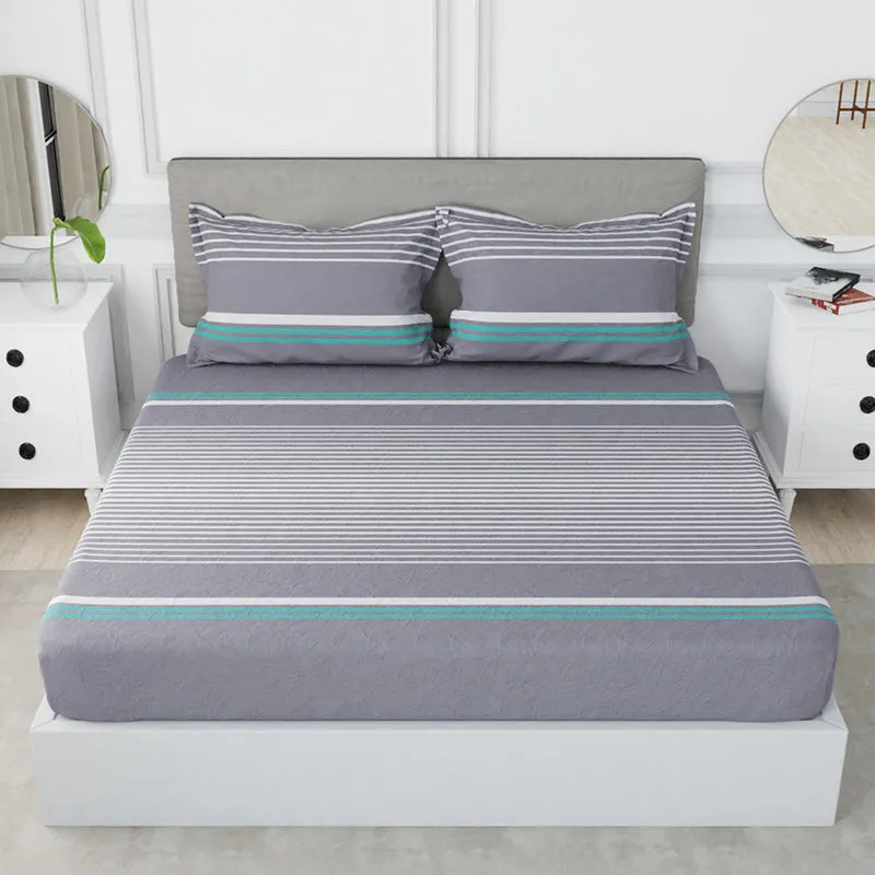 Front view of grey striped bedsheet with matching pillow covers on a white bed