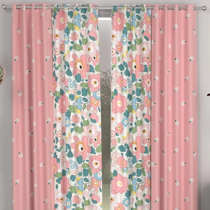 Close view of pink and multicolour floral curtains on an eyelet rod