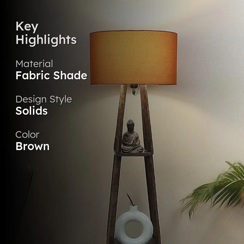Rust floor lamp with wooden shelf base in a styled room