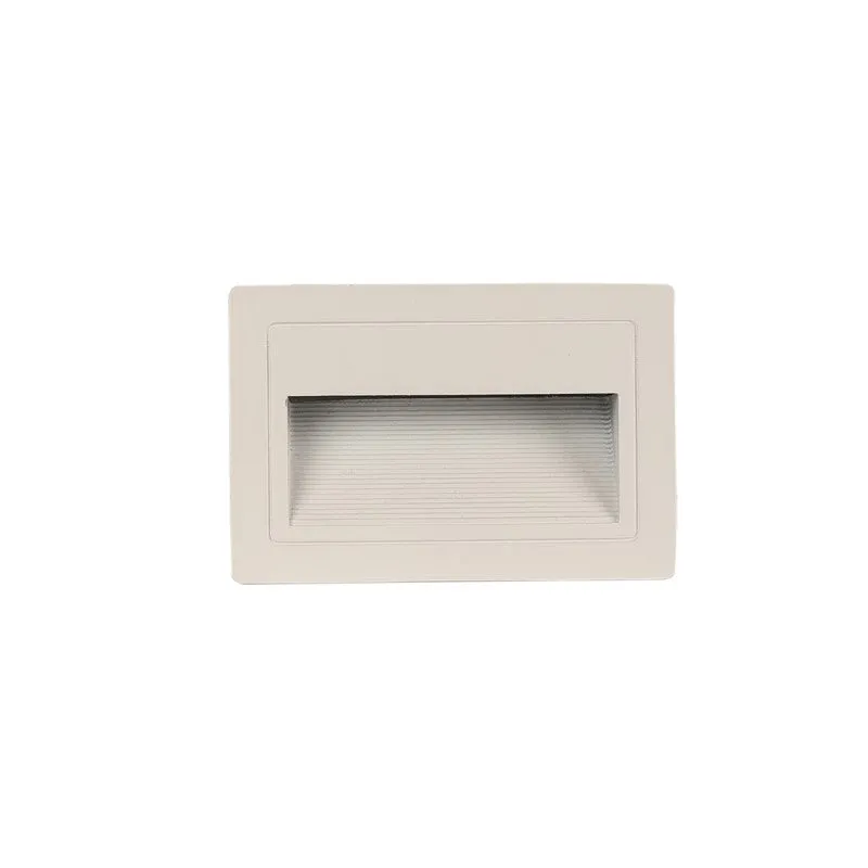 Front view of a white rectangular step light with ribbed diffuser