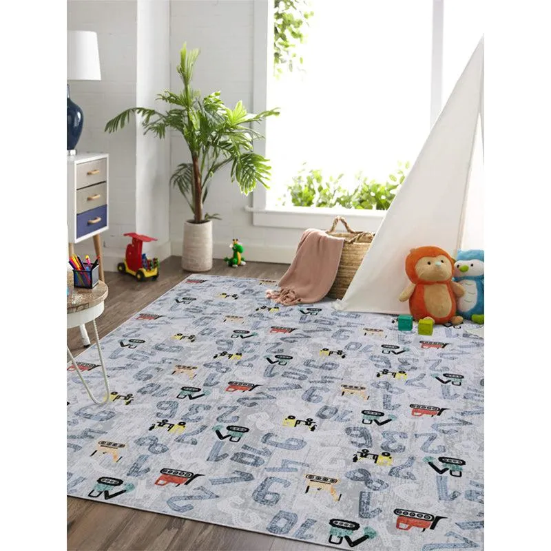 Blue and white kids carpet with numbers and toy vehicle motifs in a playroom