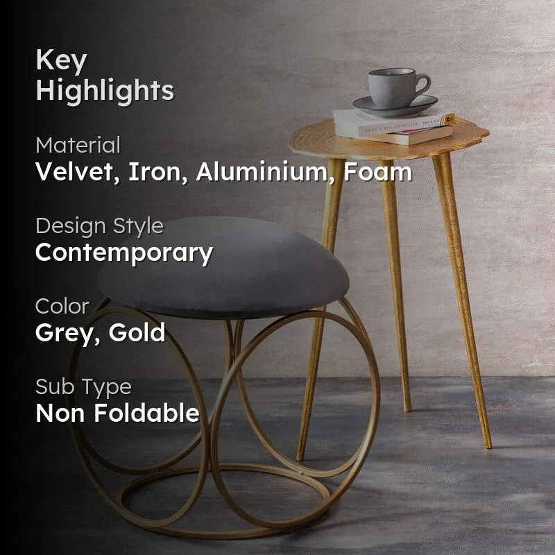 Grey velvet stool and tall gold accent table with key highlights overlay