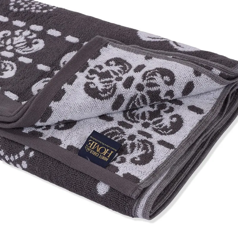 Close-up of folded grey and white bath towel showing reverse side