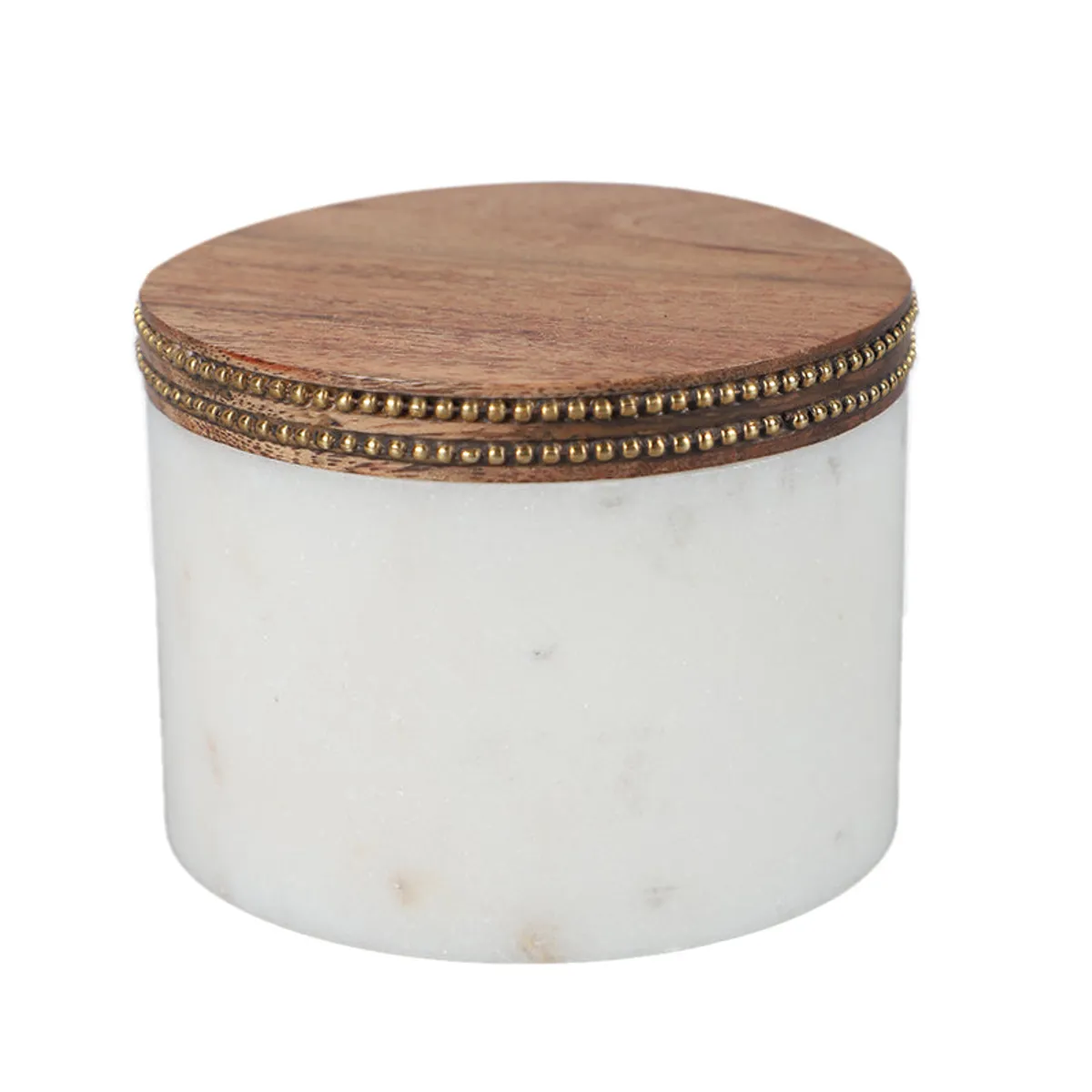 Close view of white marble jar with wood lid and brass beaded rim