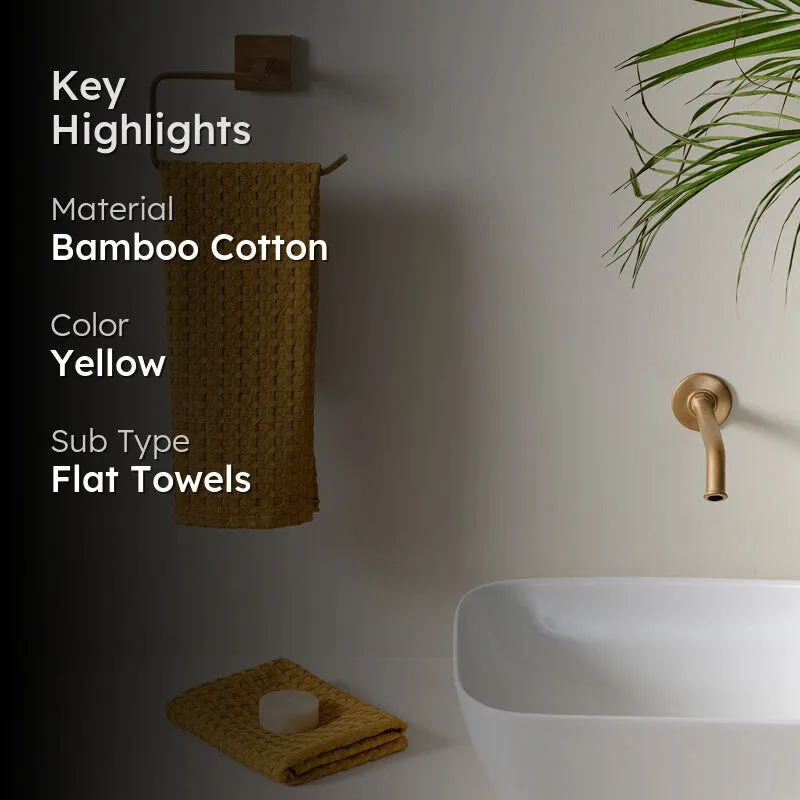 Yellow waffle hand towel in a bathroom setting