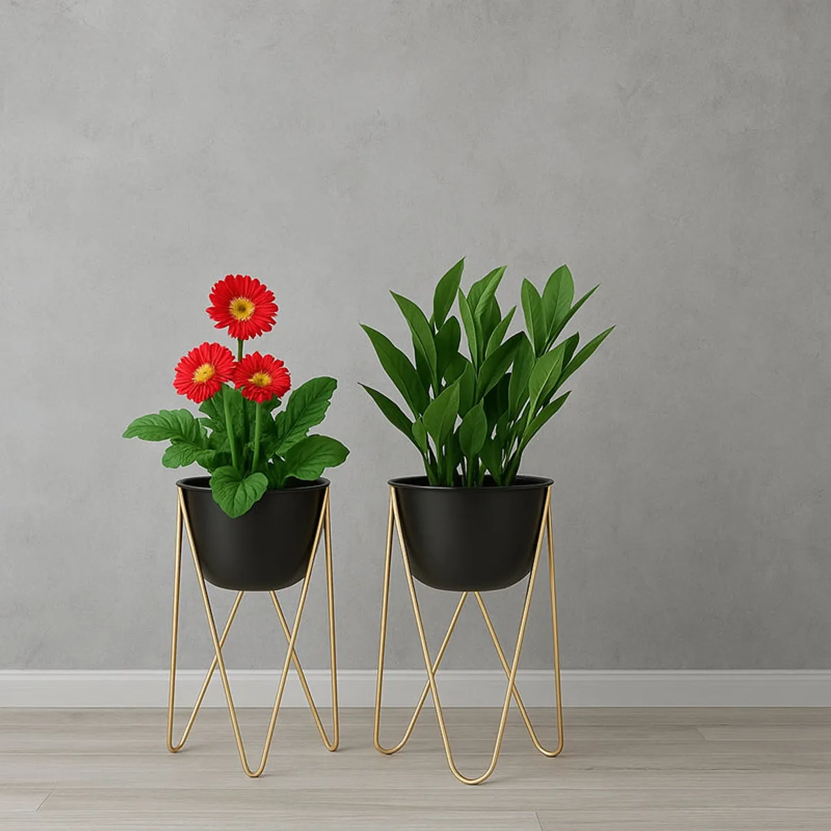 Two black planters on gold stands with leafy plants against a grey wall