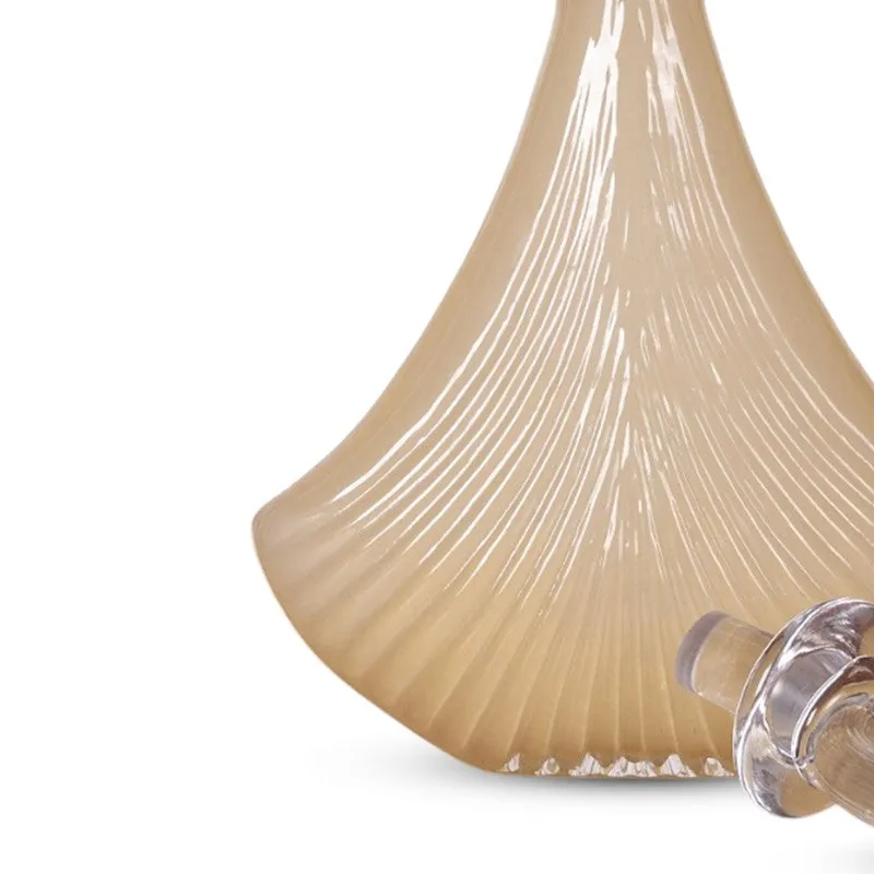 Close-up of the vase's fluted ivory glass body and stopper