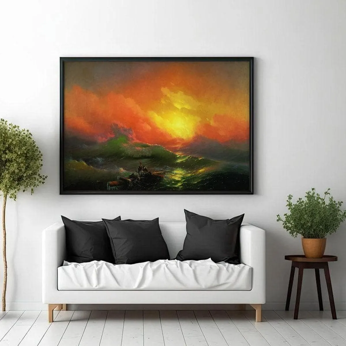 Large framed seascape wall art hung above a white sofa with dark cushions.