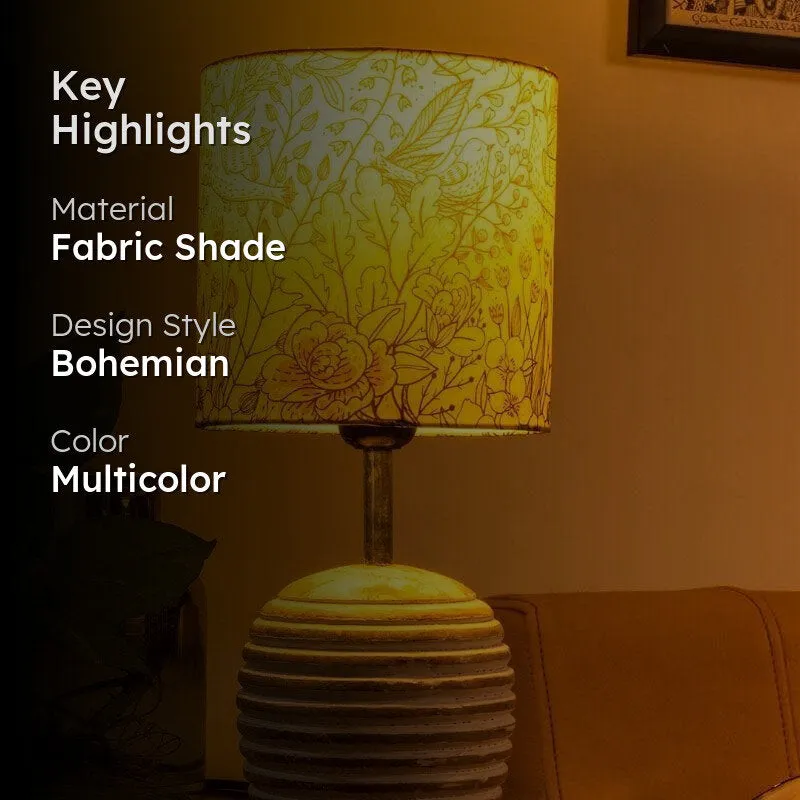 Bohemian floral table lamp with fabric shade in a warm setting