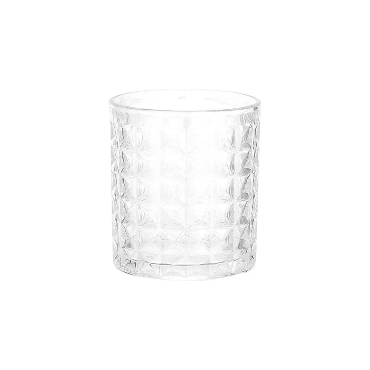 Close view of a clear whiskey glass with a geometric textured surface