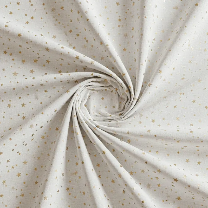 Close-up of white cotton fabric with scattered yellow floral print