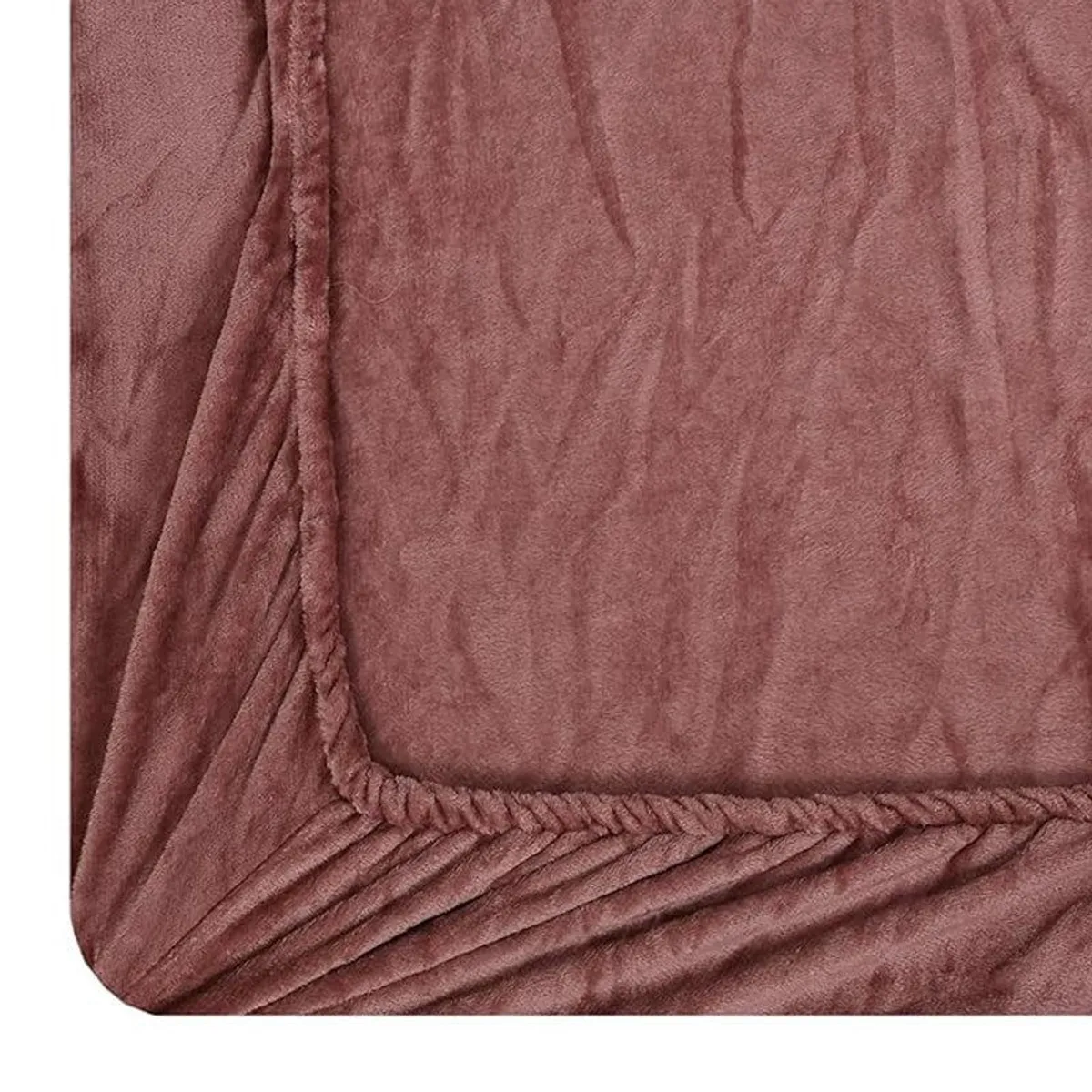 Close-up showing the elasticated corner and textured bedsheet surface