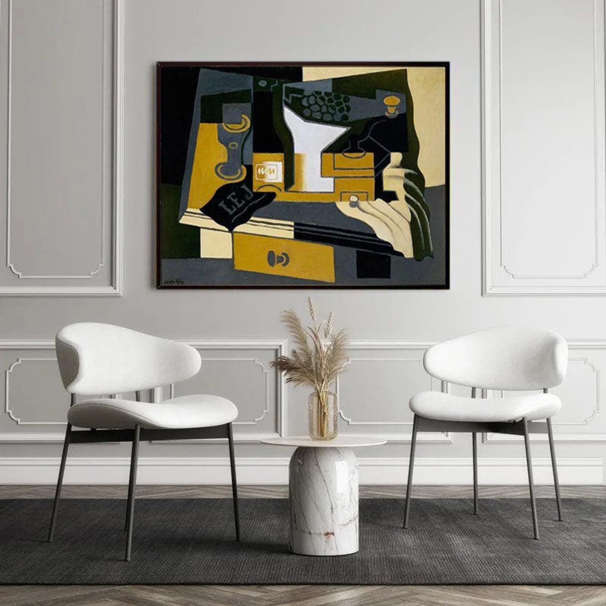 Abstract black-framed wall painting styled above two white chairs