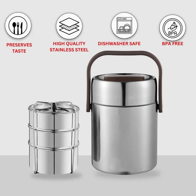 Silver tiffin carrier beside its stacked container holder on a plain background