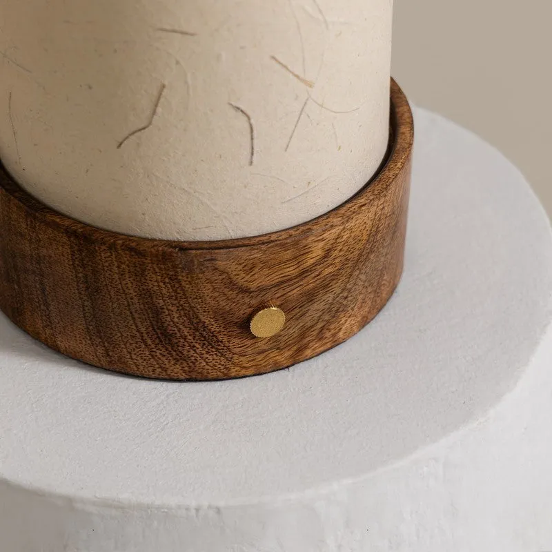 Close-up of the wooden lamp base and ivory textured shade