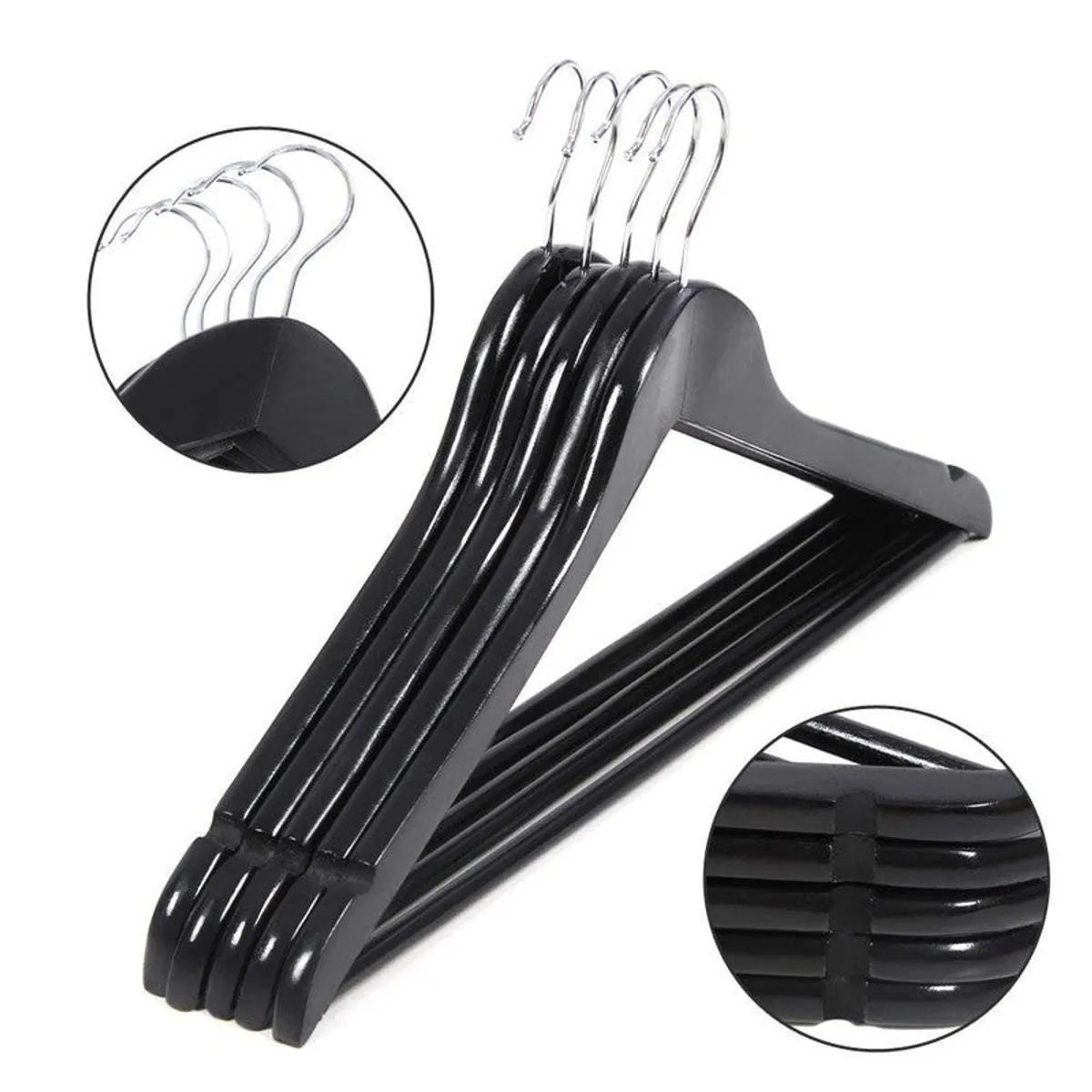 Close view of black wooden hangers with silver hooks