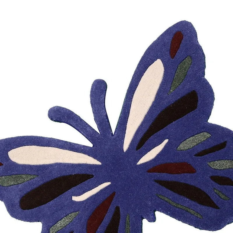 Close-up of the blue carpet showing soft textured pile and butterfly wing details