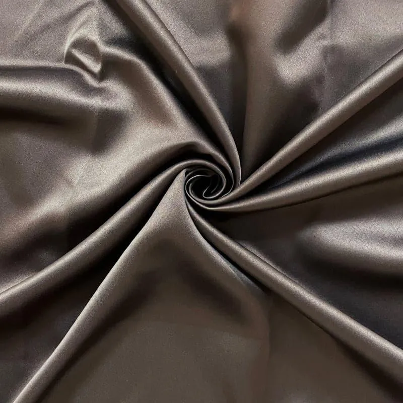Close-up of smooth brown curtain fabric with a silky sheen