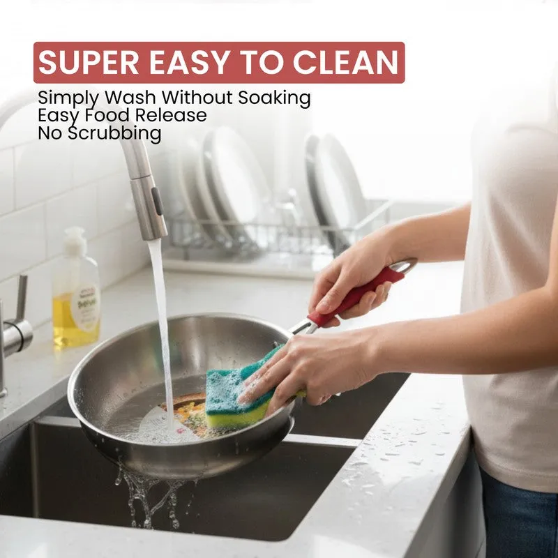 Person washing the stainless steel frying pan under running water.