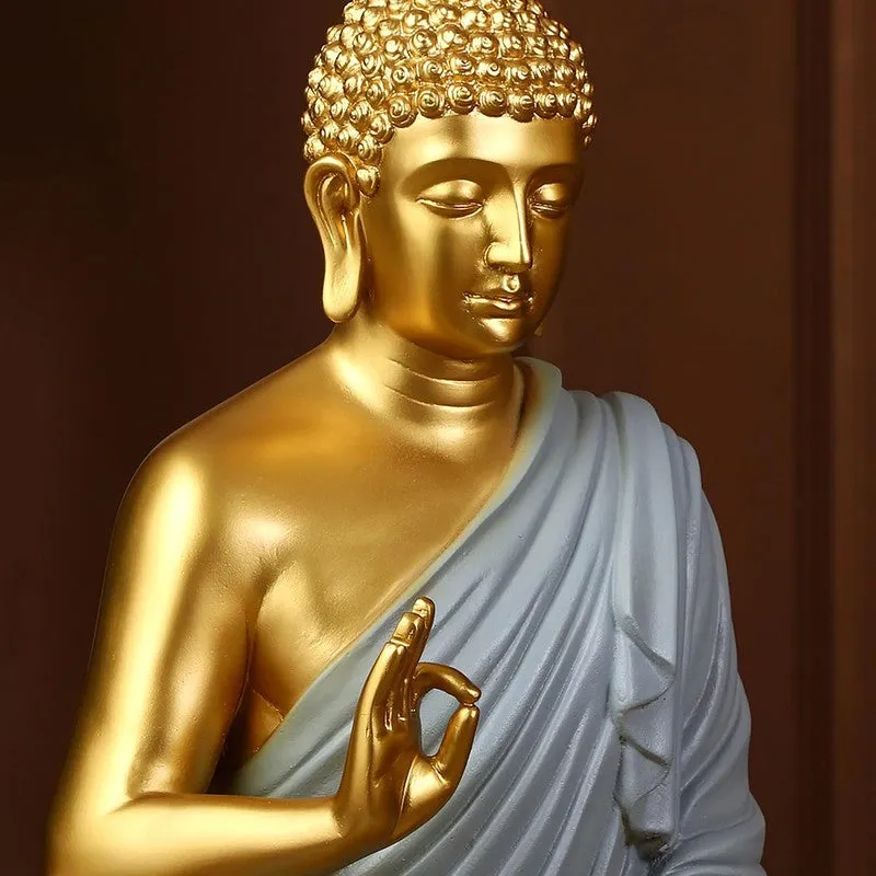 Close-up of Buddha idol upper body with gold face and grey robe
