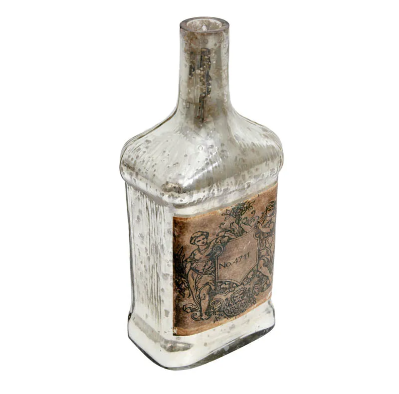 Angled view of a speckled glass bottle vase with vintage-style label
