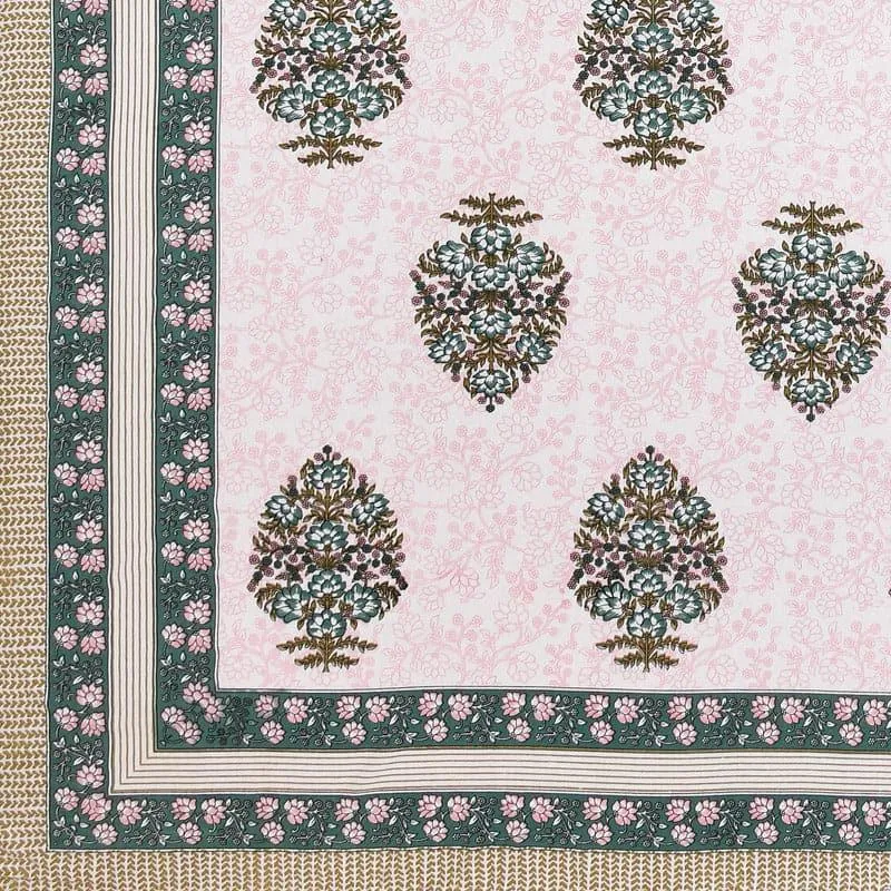 Close-up of bedsheet print with floral motifs and bordered edge